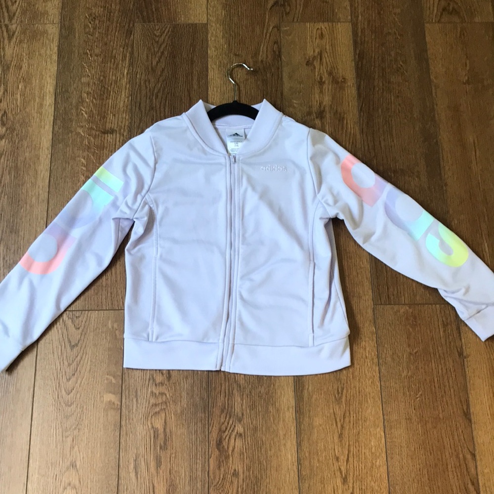 An Adidas light purple zip up jacket